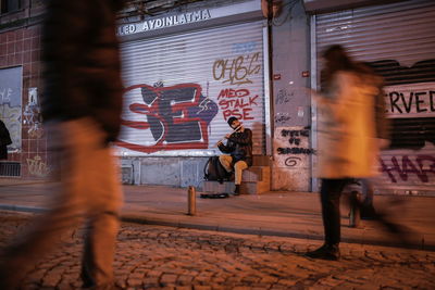 People walking on street in city