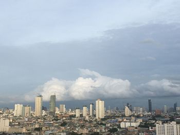 Modern buildings in city against sky