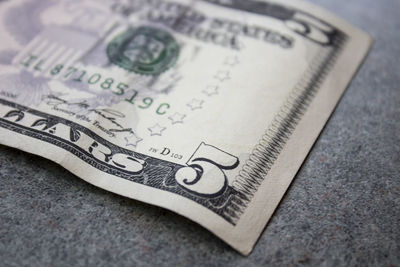 Close-up of paper currency on table