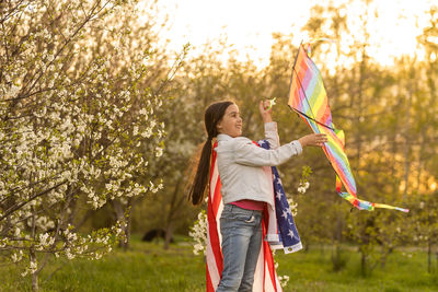 Little girl with kite and usa flag