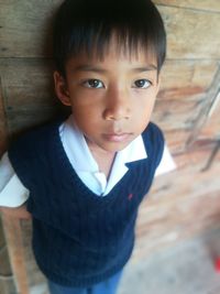 Portrait of cute boy standing outdoors