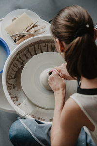 High angle view of woman sitting at home