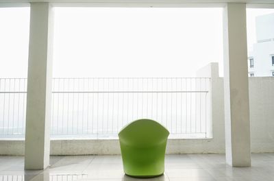 Green table against white wall