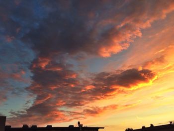 Low angle view of cloudy sky at sunset