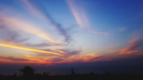 Low angle view of dramatic sky during sunset