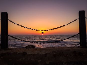 Scenic view of sea at sunset