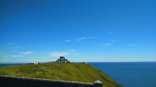 Scenic view of sea against blue sky