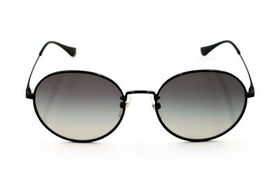 Close-up of sunglasses against white background