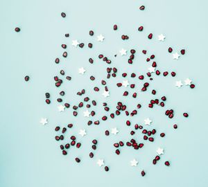 High angle view of multi colored candies against blue background