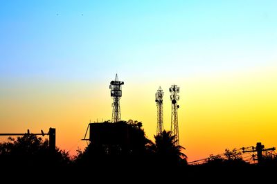 Low angle view of silhouette building against sky during sunset