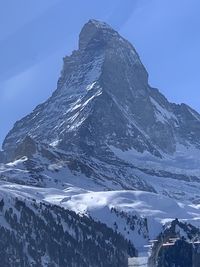 Scenic view of snowcapped mountains against clear sky