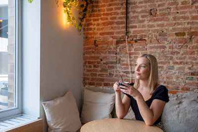 Young woman using phone