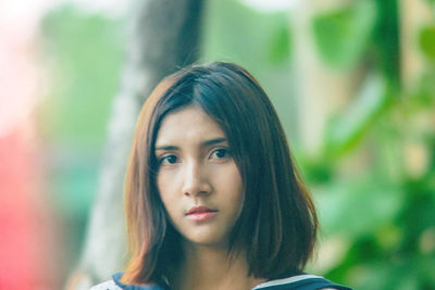 Close-up portrait of a teenage girl outdoors