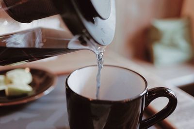 Close-up of water being poured into cup