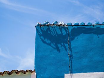 Low angle view of built structure against blue sky