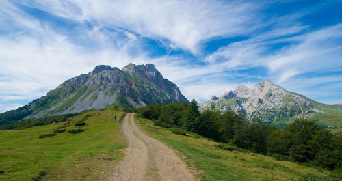 Road amidst mountains against sky