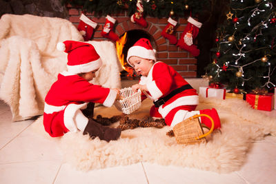 Group of people sitting on christmas tree