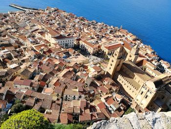 High angle view of townscape by sea