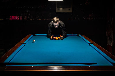 Man playing pool on table