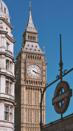 Low angle view of clock tower against sky