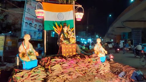 People at street market in city at night