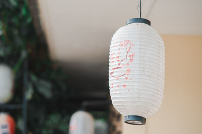 Close-up of hand holding light bulb