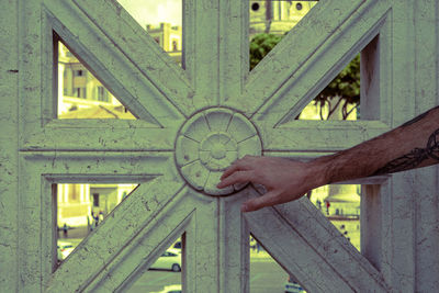 Close-up of hand holding umbrella