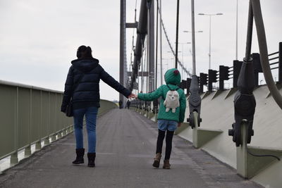 Mother and daughter bridge walk