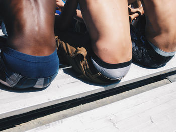 Low section of people sitting outdoors