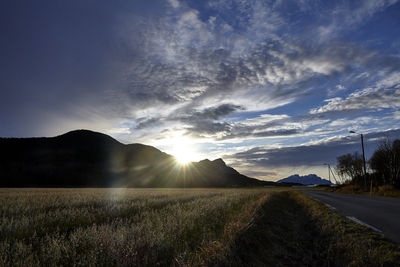 Scenic view of field against sky during sunset