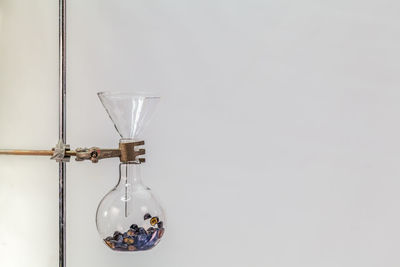 Close-up of alcohol hanging against wall