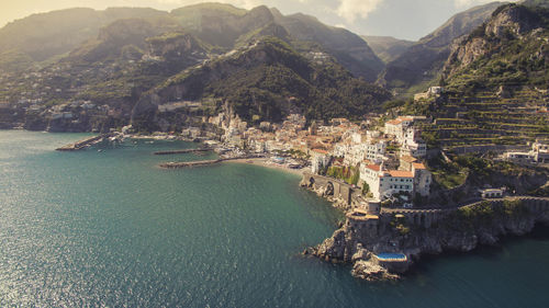 High angle view of townscape by sea