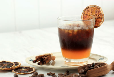 Orange and coffee cocktail or oramge espresso, coffee shot with juice and soda, copy space