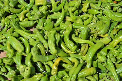 Full frame shot of green chili peppers for sale in market