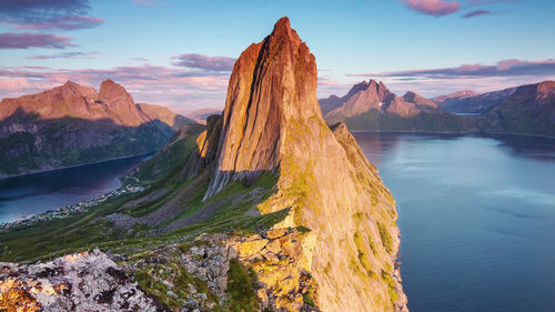 Scenic view of lake and mountains against sky