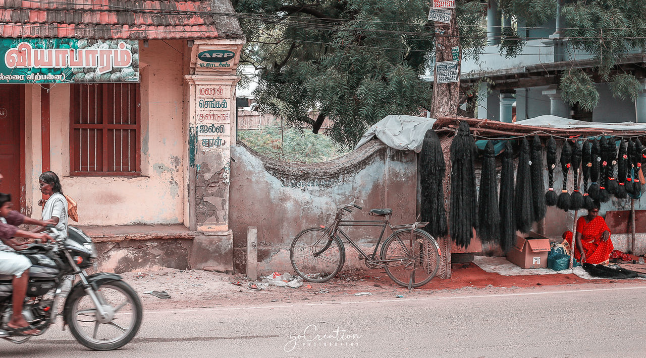 BICYCLES ON STREET AGAINST BUILDINGS