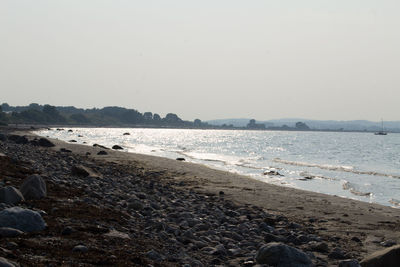 Scenic view of beach against clear sky