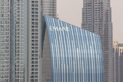 Low angle view of modern buildings against sky in city