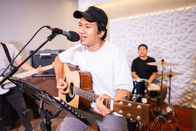 Young man playing guitar