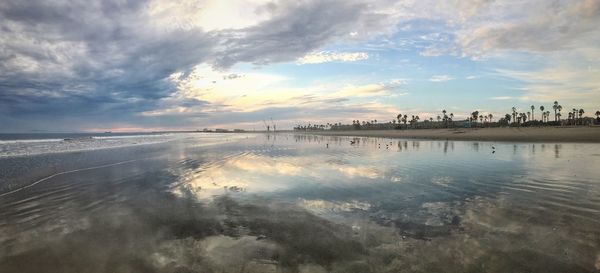 Scenic view of calm sea at sunset