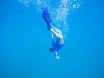 Woman swimming in sea