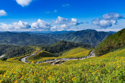 Scenic view of landscape and mountains against sky