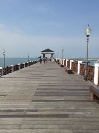 Pier over sea against sky