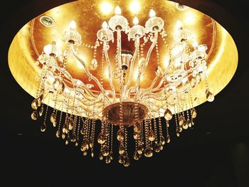 Low angle view of chandelier hanging from ceiling