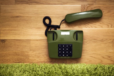 Close-up of telephone on table