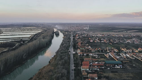 High angle view of river amidst buildings in city