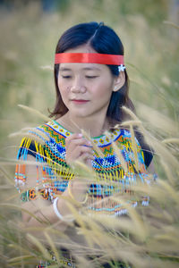 Portrait of young woman looking away