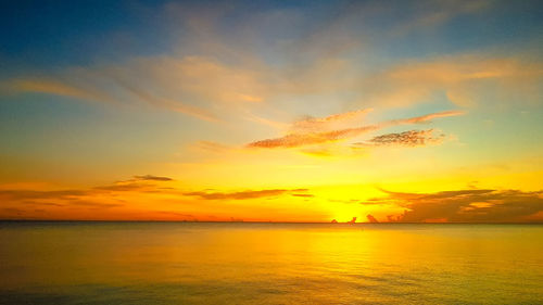 Scenic view of sea against romantic sky at sunset