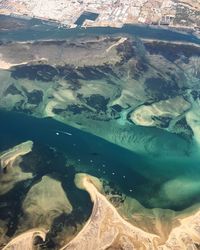 High angle view of sea seen through airplane window