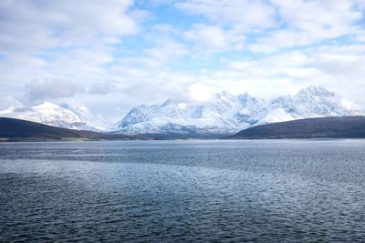 Scenic view of lake against cloudy sky